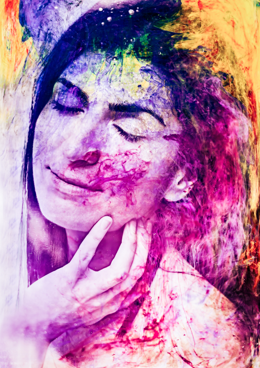 A woman with closed eyes and a serene expression, her face and hand overlaid with vibrant, swirling abstract colors in purple, pink, yellow, and green hues.
