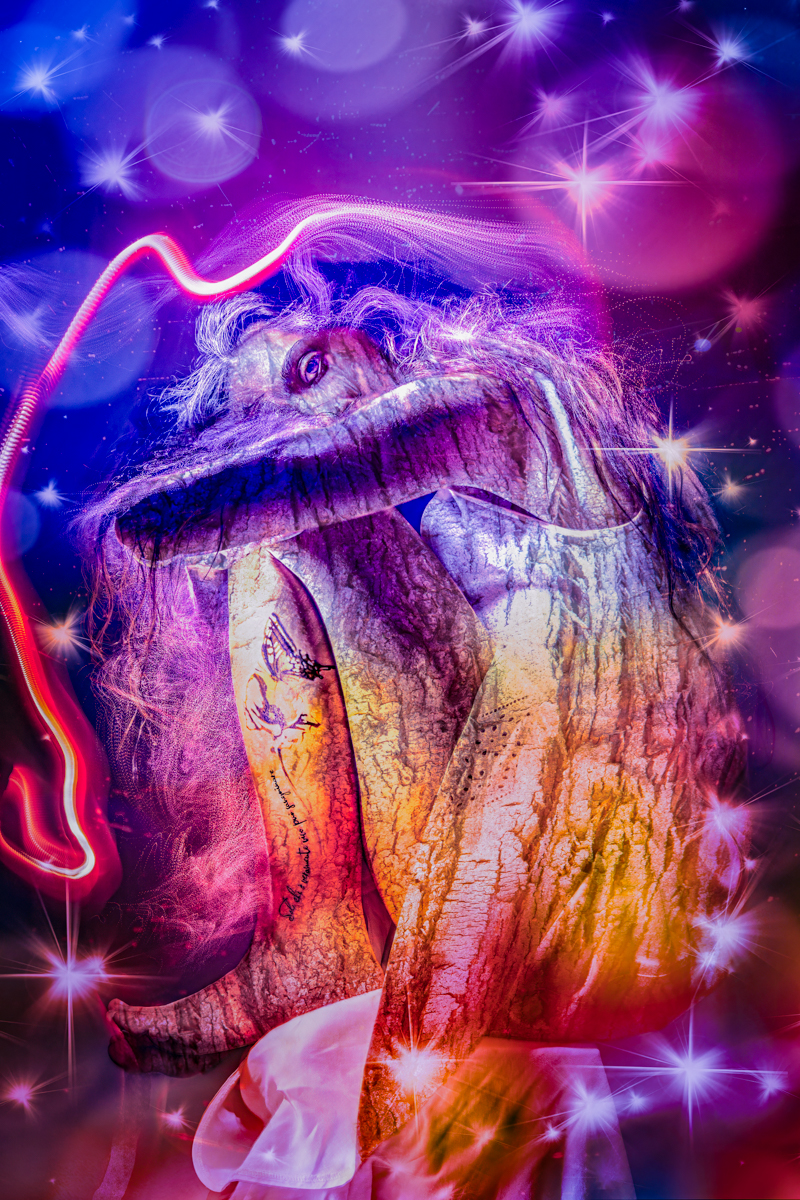 A surreal, artistic image of a person curled up, with their texture resembling tree bark, surrounded by vibrant cosmic lights and sparkles on a purple background.